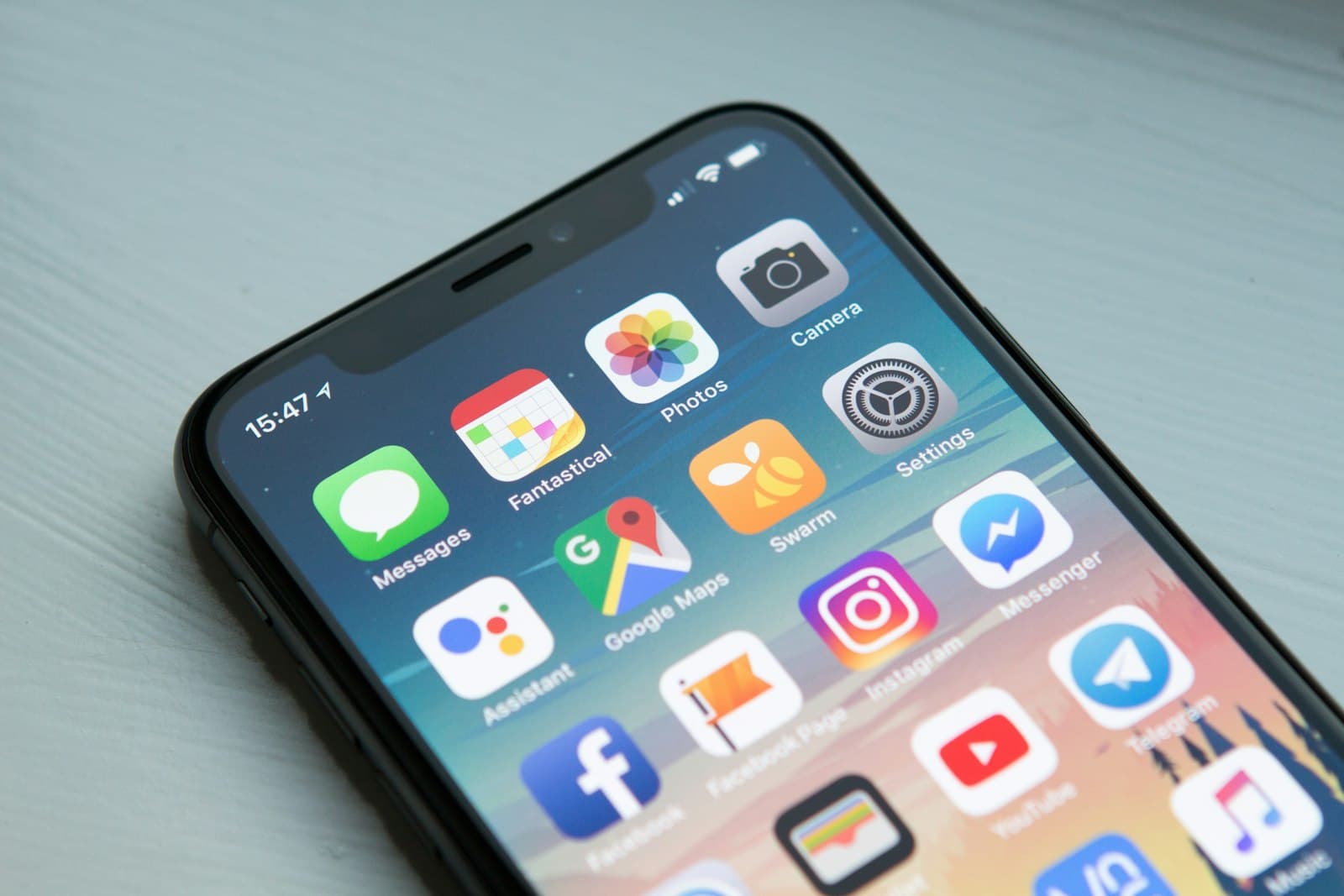 A phone home screen full of colourful app icons